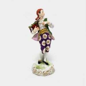 Porcelain Figurine Of A Man Holding A Potted Plant