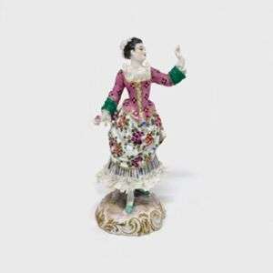 Porcelain Figurine Of A Lady With A Lacy Dress